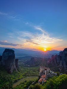Preview wallpaper castle, sun, rays, rocks