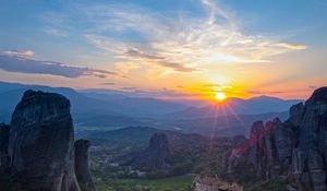 Preview wallpaper castle, sun, rays, rocks
