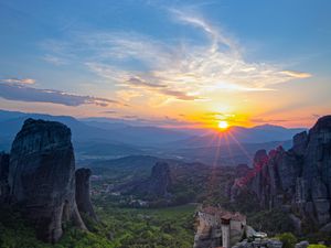 Preview wallpaper castle, sun, rays, rocks