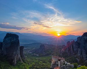 Preview wallpaper castle, sun, rays, rocks