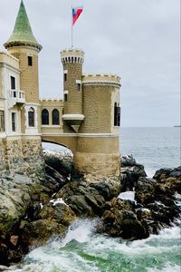 Preview wallpaper castle, towers, architecture, stones, sea, water