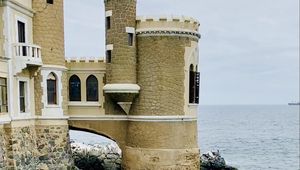 Preview wallpaper castle, towers, architecture, stones, sea, water