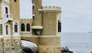 Preview wallpaper castle, towers, architecture, stones, sea, water