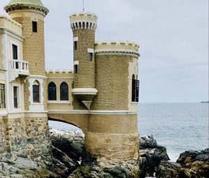 Preview wallpaper castle, towers, architecture, stones, sea, water