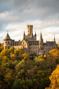 Preview wallpaper castle, towers, trees, forest, autumn