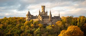 Preview wallpaper castle, towers, trees, forest, autumn