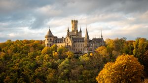 Preview wallpaper castle, towers, trees, forest, autumn