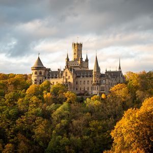 Preview wallpaper castle, towers, trees, forest, autumn