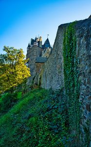 Preview wallpaper castle, wall, hill, tree, grass