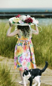 Preview wallpaper cat, child, hat, field, grass