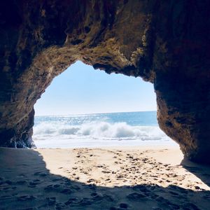 Preview wallpaper cave, arch, beach, sea, sand