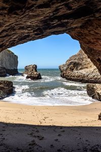 Preview wallpaper cave, coast, sea, rocks, view