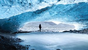 Preview wallpaper cave, ice, man, glacier, frozen