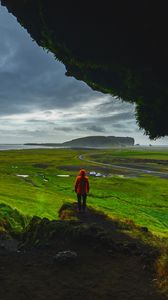 Preview wallpaper cave, man, landscape, coast, greenery