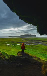 Preview wallpaper cave, man, landscape, coast, greenery