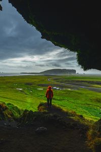 Preview wallpaper cave, man, landscape, coast, greenery