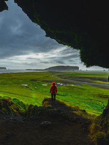 Preview wallpaper cave, man, landscape, coast, greenery