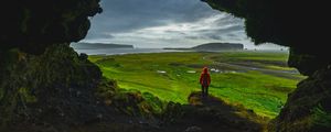 Preview wallpaper cave, man, landscape, coast, greenery