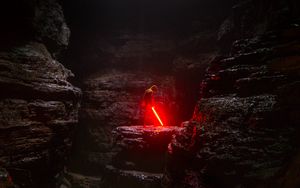 Preview wallpaper cave, man, lightsaber, light