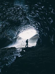 Preview wallpaper cave, man, silhouette, alone, dark