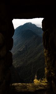 Preview wallpaper cave, mountain, forest, peak, mountain range