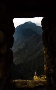 Preview wallpaper cave, mountain, forest, peak, mountain range