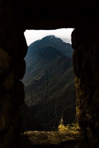 Preview wallpaper cave, mountain, forest, peak, mountain range