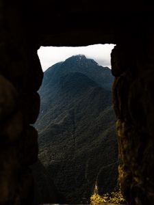 Preview wallpaper cave, mountain, forest, peak, mountain range