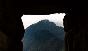 Preview wallpaper cave, mountain, forest, peak, mountain range