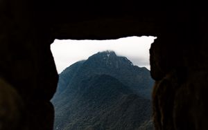 Preview wallpaper cave, mountain, forest, peak, mountain range