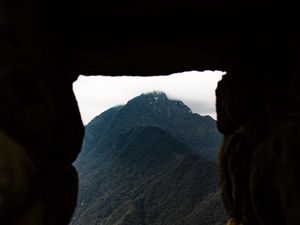 Preview wallpaper cave, mountain, forest, peak, mountain range