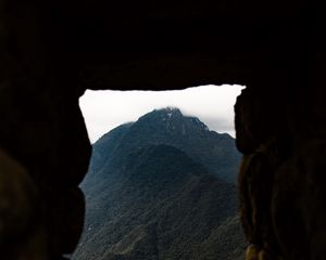 Preview wallpaper cave, mountain, forest, peak, mountain range