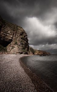 Preview wallpaper cave, pebbles, sea, clouds, nature