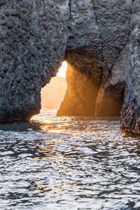 Preview wallpaper cave, rock, sunlight, water, sea