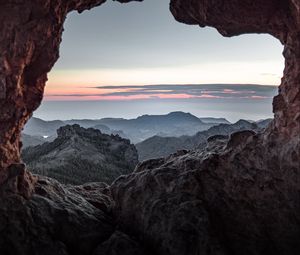 Preview wallpaper cave, rocks, relief, sky