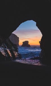 Preview wallpaper cave, rocks, sea, sunset