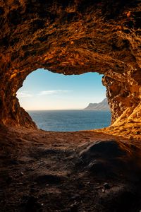 Preview wallpaper cave, rocks, stones, sea, horizon