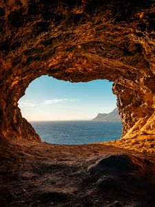 Preview wallpaper cave, rocks, stones, sea, horizon