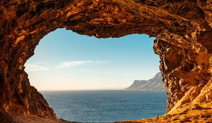 Preview wallpaper cave, rocks, stones, sea, horizon