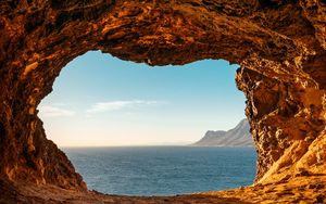 Preview wallpaper cave, rocks, stones, sea, horizon