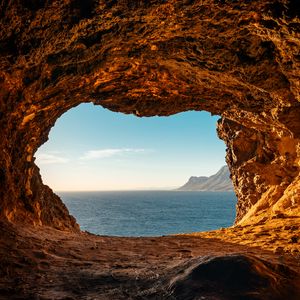 Preview wallpaper cave, rocks, stones, sea, horizon