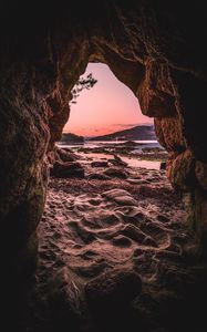 Preview wallpaper cave, sand, stones, sea, nature