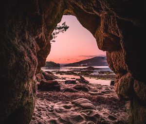 Preview wallpaper cave, sand, stones, sea, nature