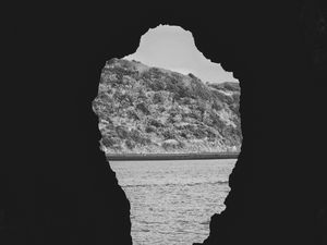 Preview wallpaper cave, sea, hill, black and white