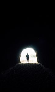 Preview wallpaper cave, silhouette, alone, dark