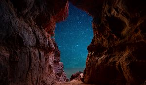 Preview wallpaper cave, starry sky, stars, rocks, desert