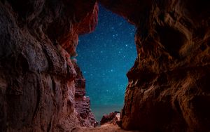 Preview wallpaper cave, starry sky, stars, rocks, desert