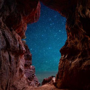 Preview wallpaper cave, starry sky, stars, rocks, desert