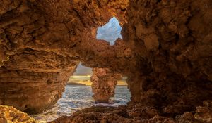 Preview wallpaper cave, stones, sea, rocks