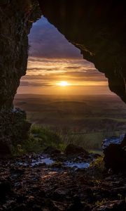 Preview wallpaper cave, sun, sunset, landscape, nature